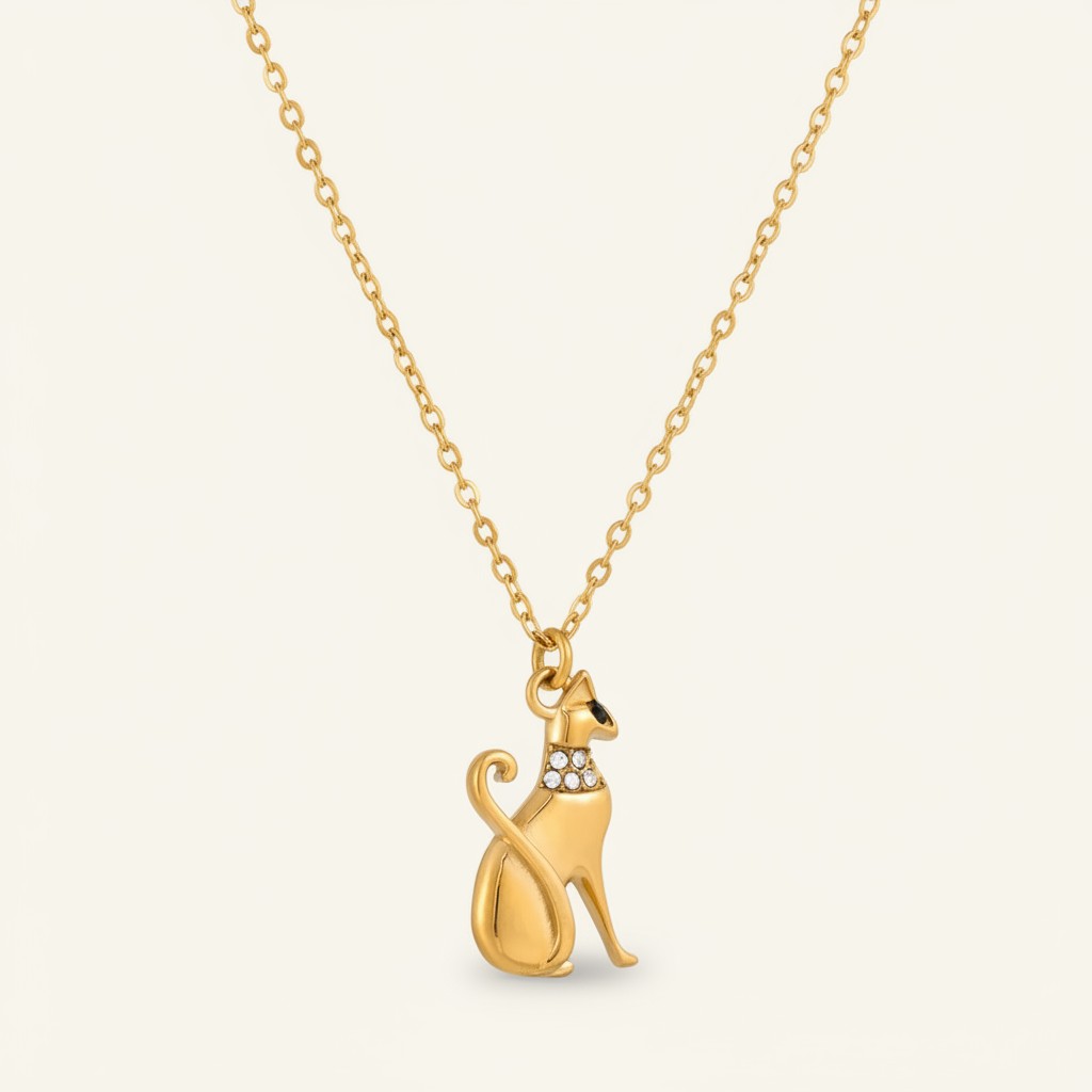 Seraphina Treasures gold cat necklace with crystal collar and black eye detail. Elegant feline pendant on a delicate chain.