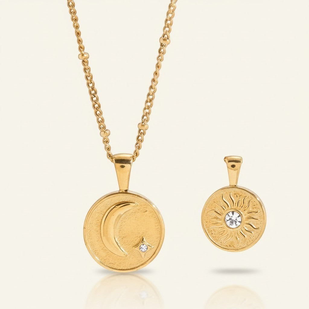Seraphina Treasures gold celestial necklace with moon, star, and sun motifs. Features a delicate chain and two pendants.