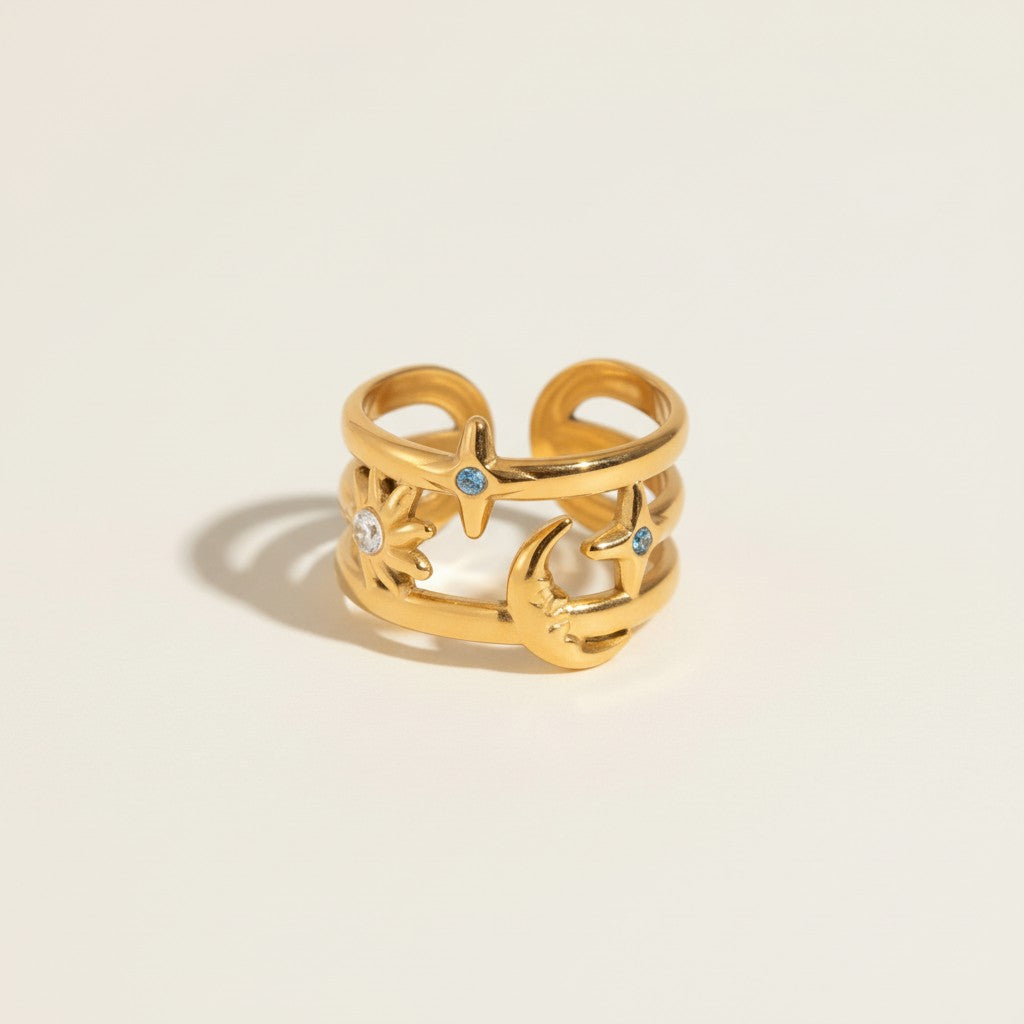 Seraphina Treasures gold open ring with sun, moon, stars and blue zircon stones. Adjustable band.