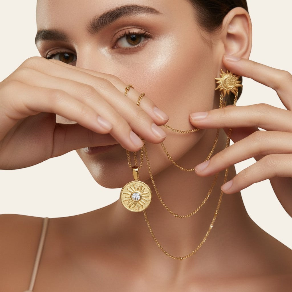 Seraphina Treasures gold celestial pendant necklace with sun motif and clear stone accent.