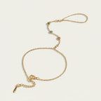 Seraphina Treasures gold chain bracelet and ring set with green, blue, and pink cubic zirconia stones.