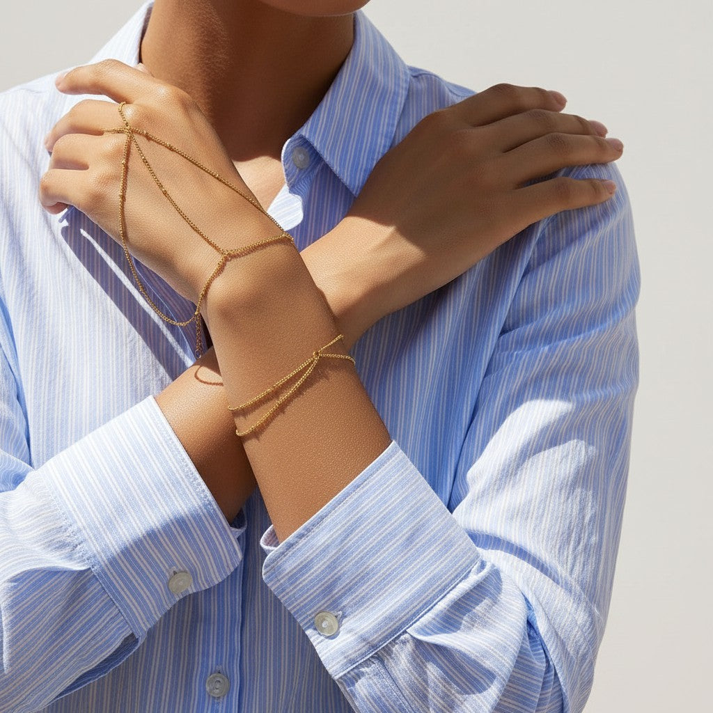 Seraphina Treasures Faustina gold chain hand bracelet with delicate bead accents.