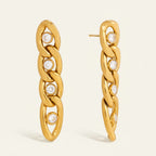 Seraphina Treasures gold chain earrings with clear zircon stones, elegant tassel design.