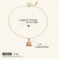 Seraphina Treasures gold necklace with a cherry pendant adorned with pink cubic zirconia stones.