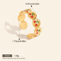 Seraphina Treasures gold-tone adjustable ring with red cherry enamel details and open design.