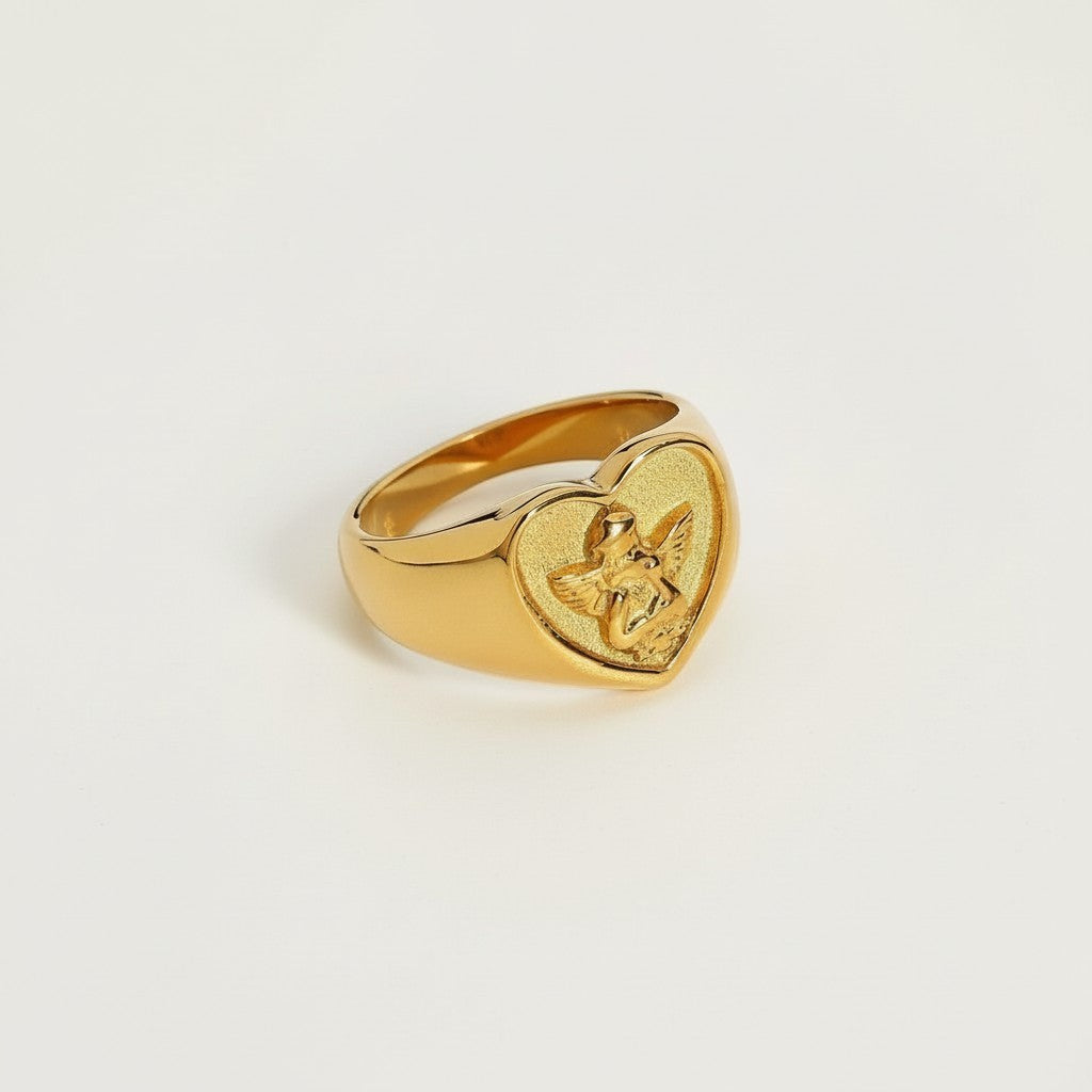 Seraphina Treasures gold heart ring with cherub detail. Symbol of love and protection.