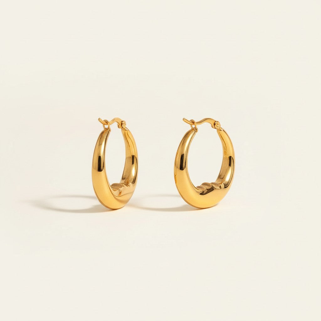 Seraphina Treasures gold crescent hoop earrings with a minimalist, celestial-inspired design.