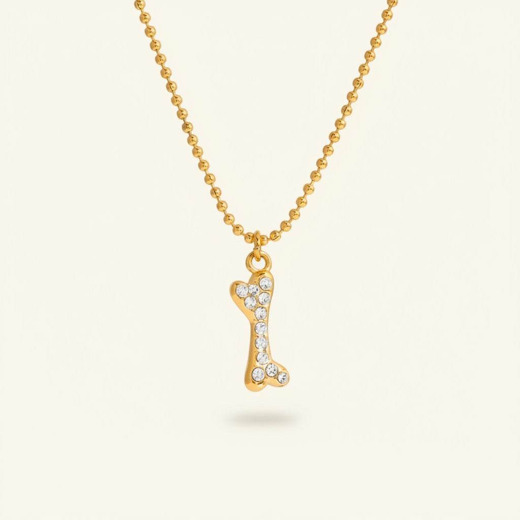 Seraphina Treasures gold bone necklace with crystal accents and ball chain.