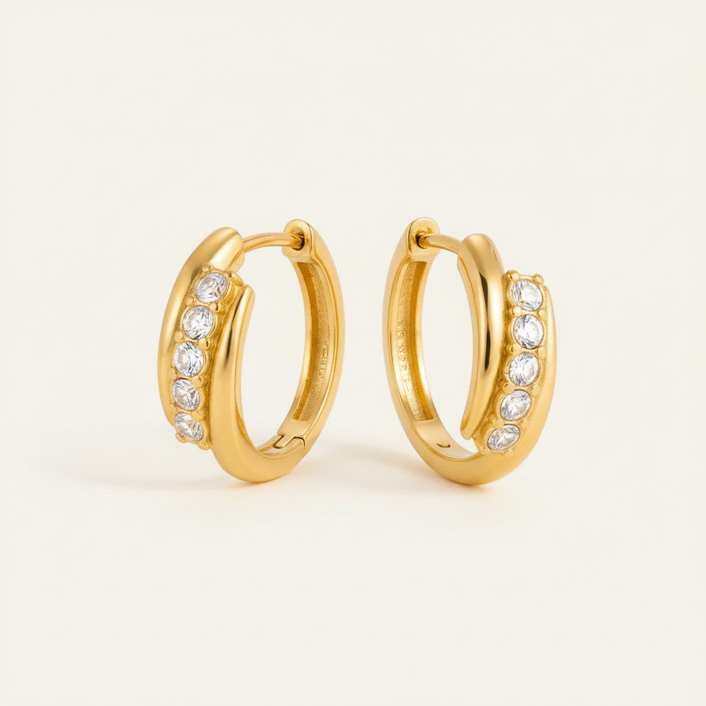 Seraphina Treasures Orinthis gold hoop earrings with clear crystals. Elegant, sparkling, and versatile for any occasion.