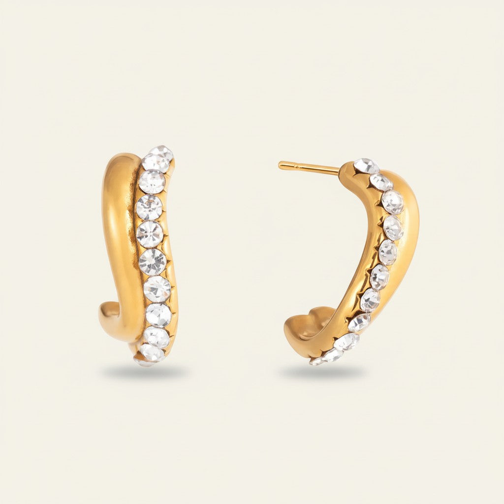 Seraphina Treasures gold-tone hoop earrings with clear crystals. Minimalist design, secure stud backing.