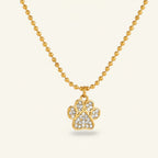 Seraphina Treasures gold-tone necklace with a crystal-encrusted cat paw pendant on a beaded chain.