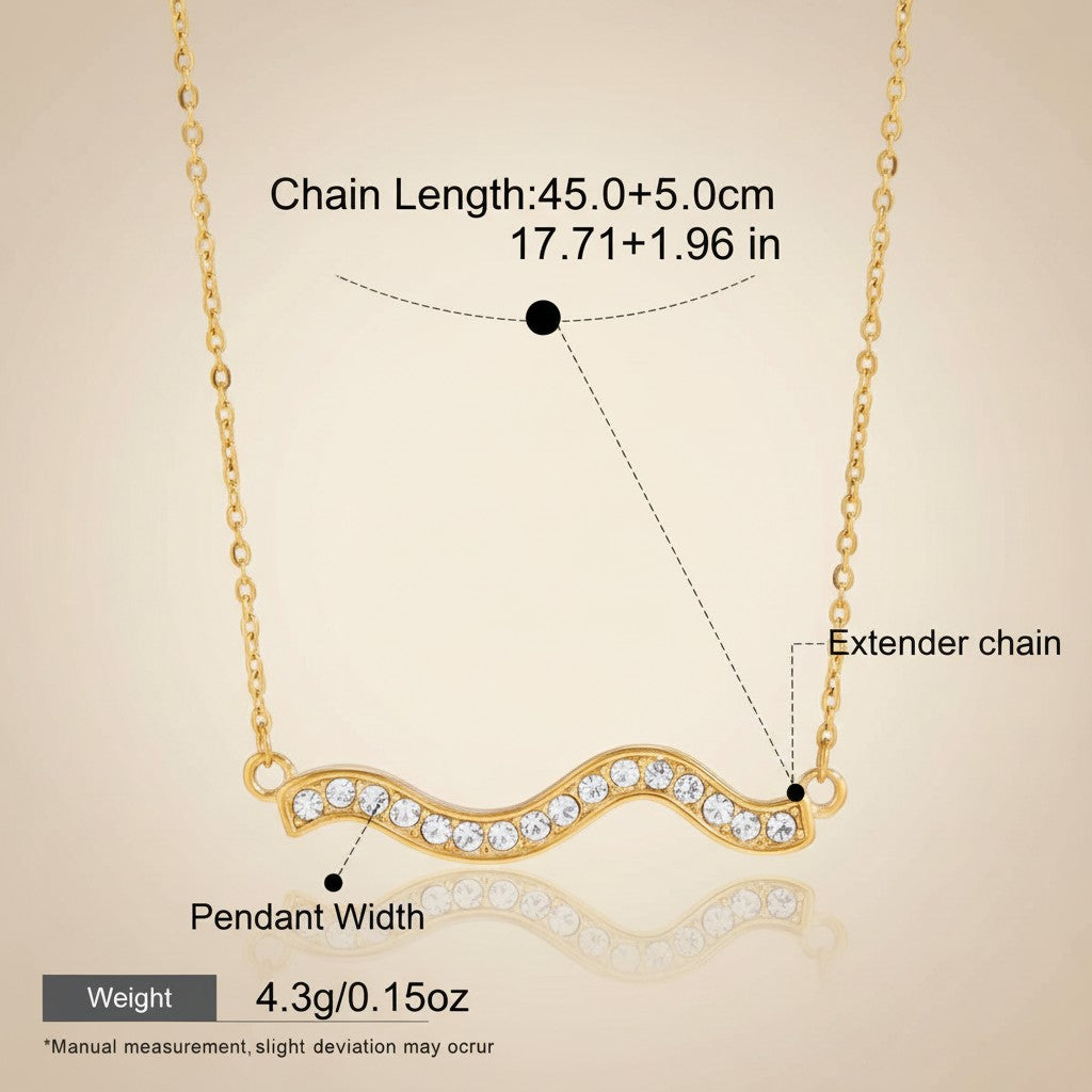 Seraphina Treasures gold wave necklace with clear crystals and extender chain. Waterproof and hypoallergenic.