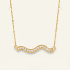Seraphina Treasures gold wave necklace with clear crystals. Elegant and versatile.
