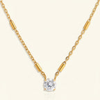 Seraphina Treasures Elarion gold necklace with cubic zirconia pendant and minimalist bar details on chain.