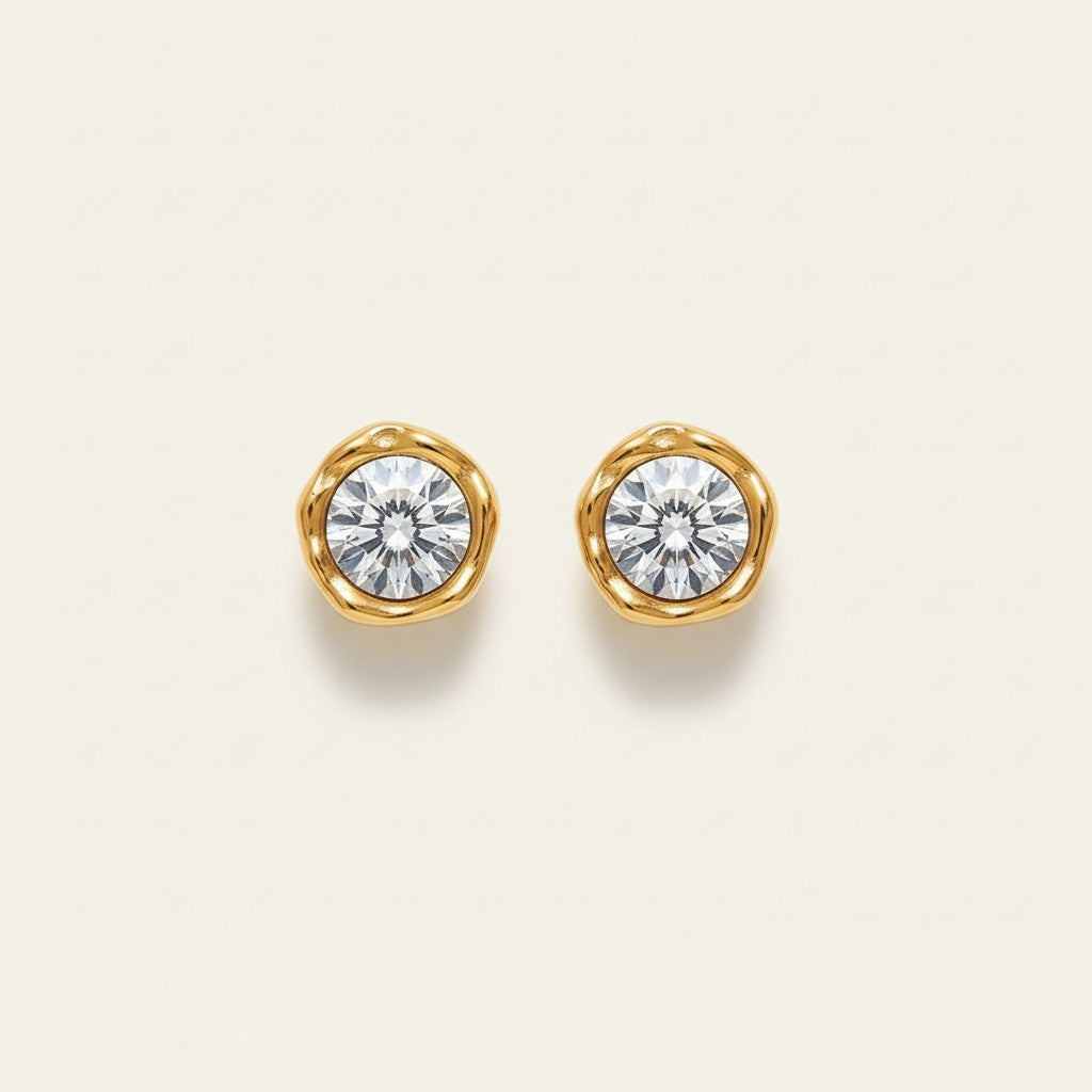 Seraphina Treasures gold stud earrings with clear round cubic zirconia, organic shape setting.