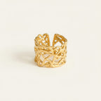 Seraphina Treasures gold cutout geometric ring with open band construction and angular patterns.