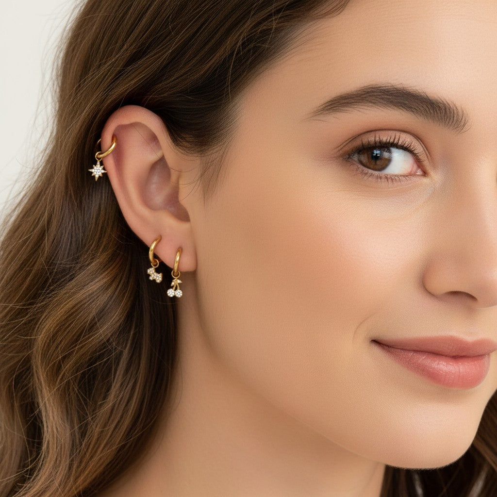 Seraphina Treasures gold hoop earrings with cubic zirconia studded dog and cherry charms.