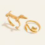 Seraphina Treasures gold dachshund ring with zirconia and gold cat ring. Modern animal-themed jewelry.