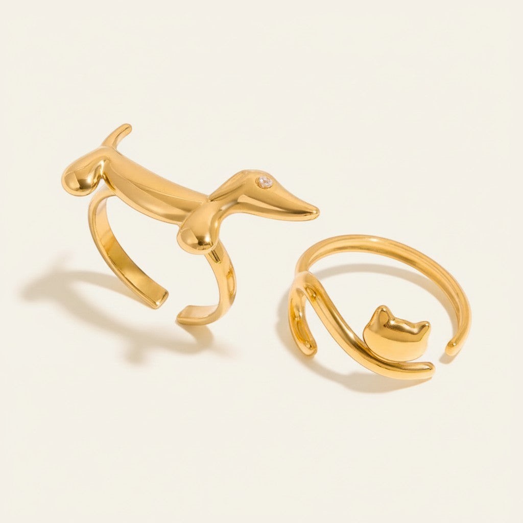 Seraphina Treasures gold dachshund ring with zirconia and gold cat ring. Modern animal-themed jewelry.