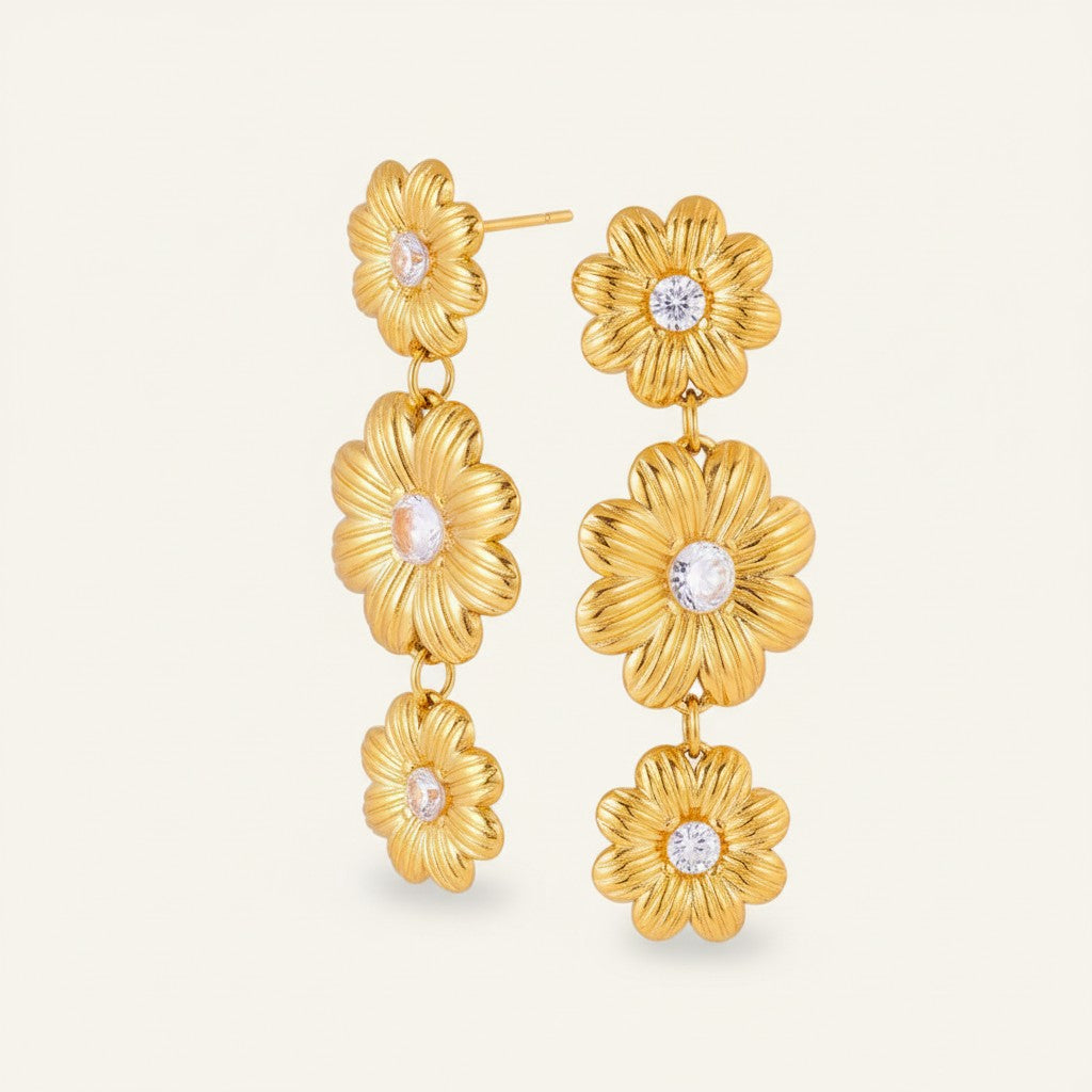 Seraphina Treasures gold-tone drop earrings with cubic zirconia in a daisy pattern. Elegant floral design.