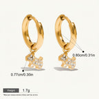 Seraphina Treasures gold-tone hoop earrings with a small, sparkling dog charm. Hypoallergenic and waterproof.