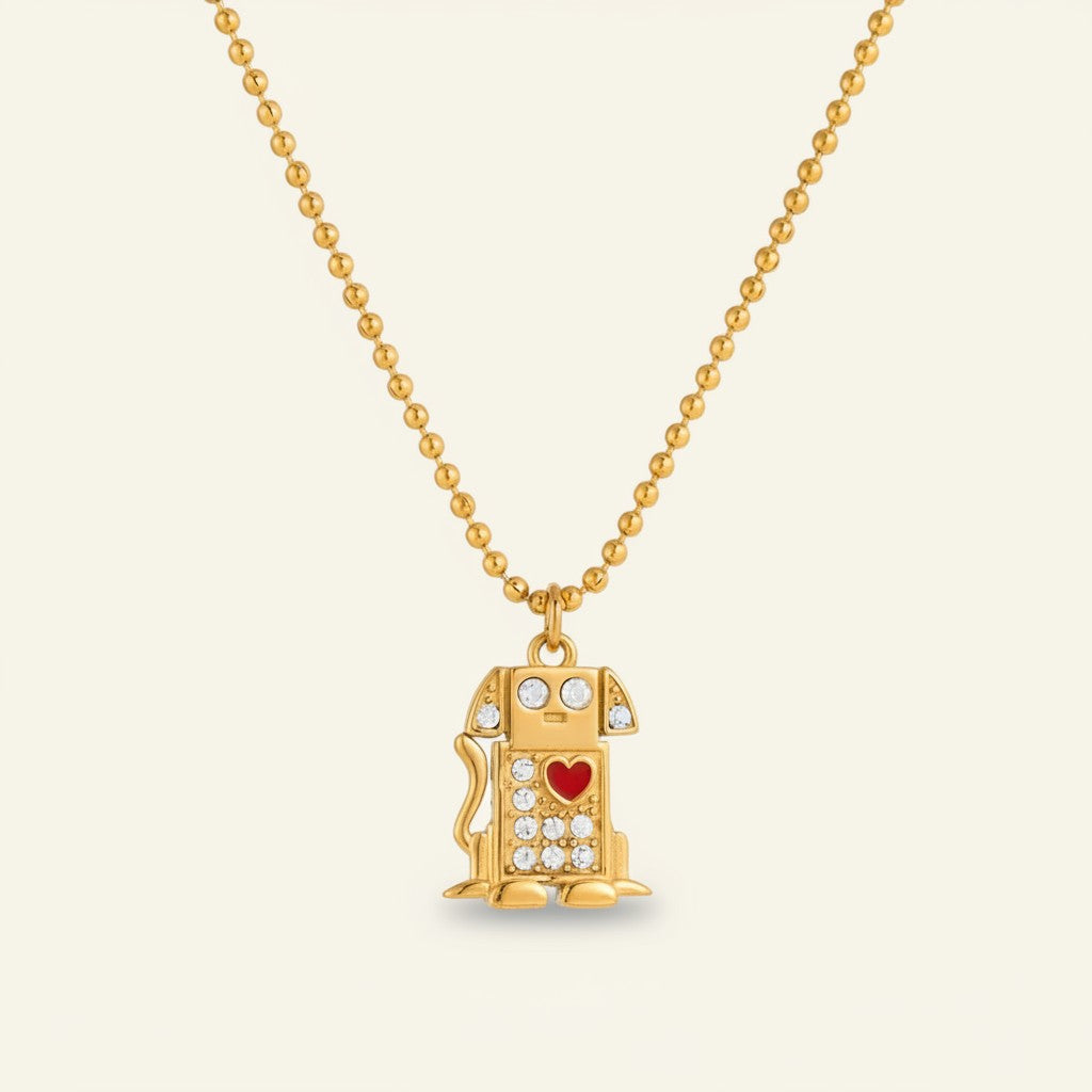 Seraphina Treasures gold dog necklace with crystal accents and a red heart detail.