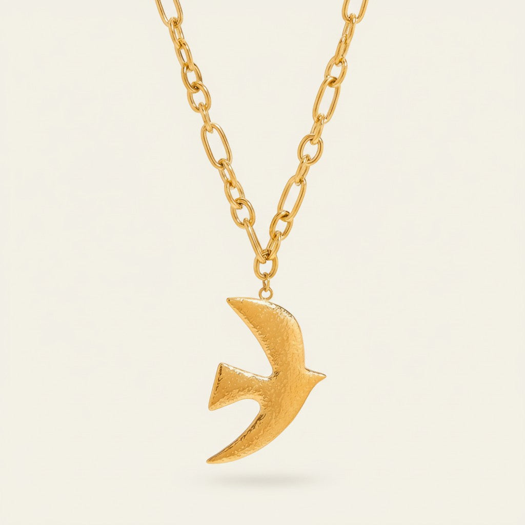 Seraphina Treasures gold dove pendant necklace with textured finish and chunky chain.