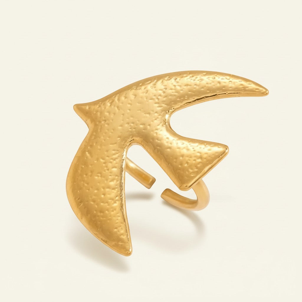 Seraphina Treasures gold dove ring, adjustable, textured finish, symbolic of peace and serenity.