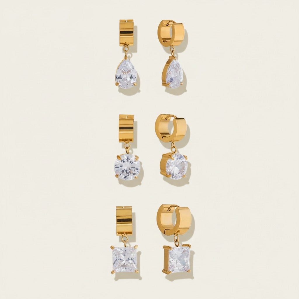 Seraphina Treasures gold drop earrings with clear cubic zirconia in pear, round, and princess cuts.