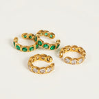 Seraphina Treasures gold ear clips with green or white zircon stones. Elegant, comfortable, and secure fit.