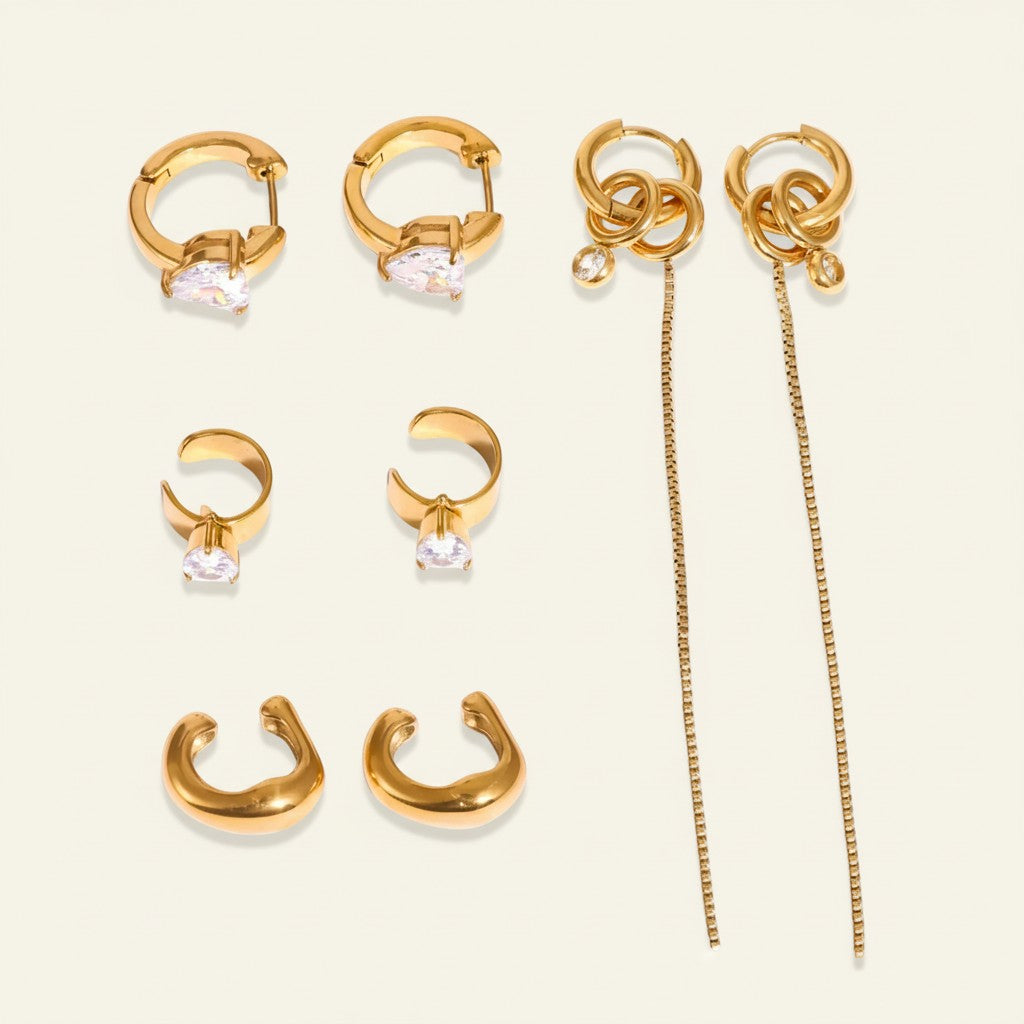 Seraphina Treasures gold-tone earrings set with zircon stones, including hoops, ear cuffs, and drop earrings.