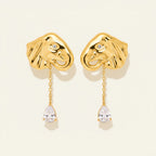 Seraphina Treasures gold elephant earrings with zircon drop, featuring intricate detail and a pear-shaped stone.