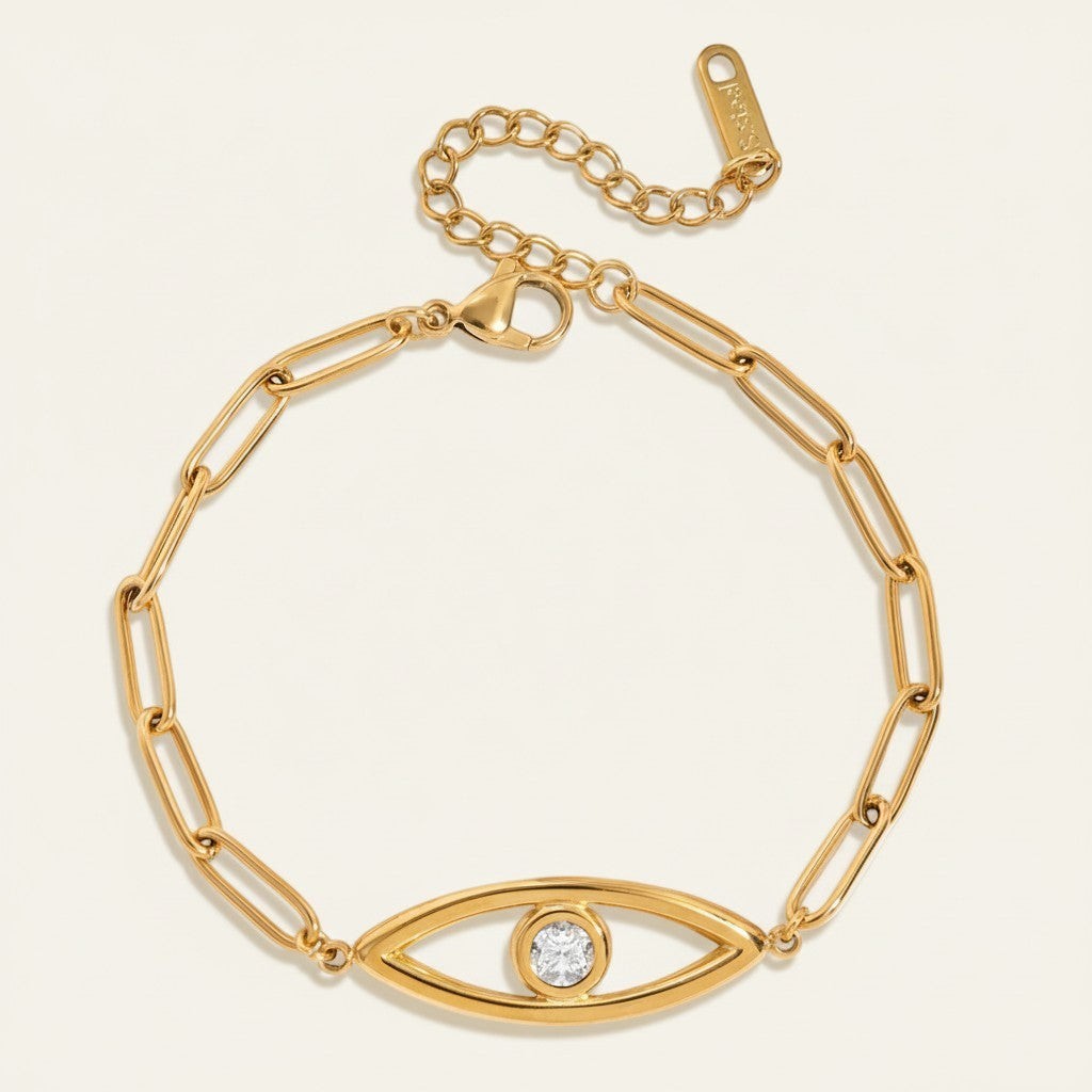 Seraphina Treasures gold-tone bracelet with paperclip chain and evil eye charm featuring a clear zircon.