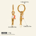 Seraphina Treasures gold fish hoop earrings with pearls and orange beads. Lightweight and hypoallergenic.