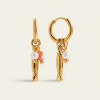 Seraphina Treasures gold hoop earrings with pearl and coral bead charms and dangling fish pendants.
