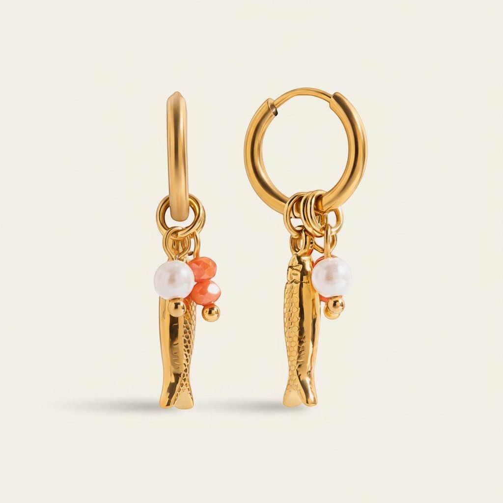 Seraphina Treasures gold hoop earrings with pearl and coral bead charms and dangling fish pendants.