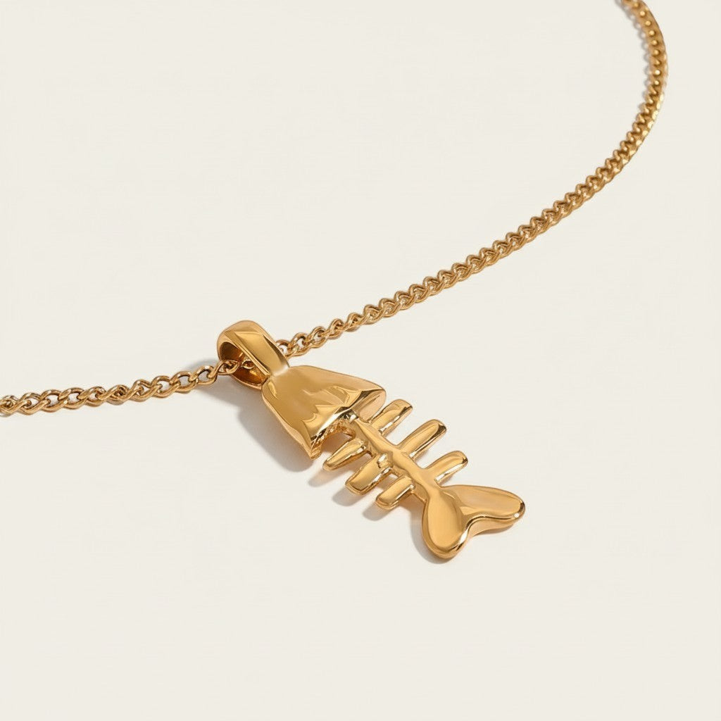 Seraphina Treasures Morwenna gold fish skeleton necklace with a delicate chain. Unique statement jewelry.