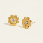 Seraphina Treasures gold floral stud earrings with cubic zirconia center. Delicate flower design.