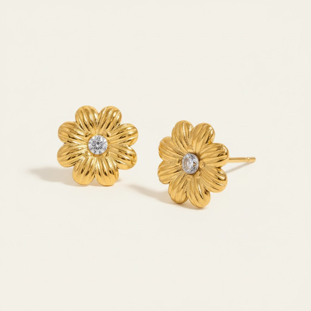 Seraphina Treasures gold floral stud earrings with cubic zirconia center. Delicate flower design.