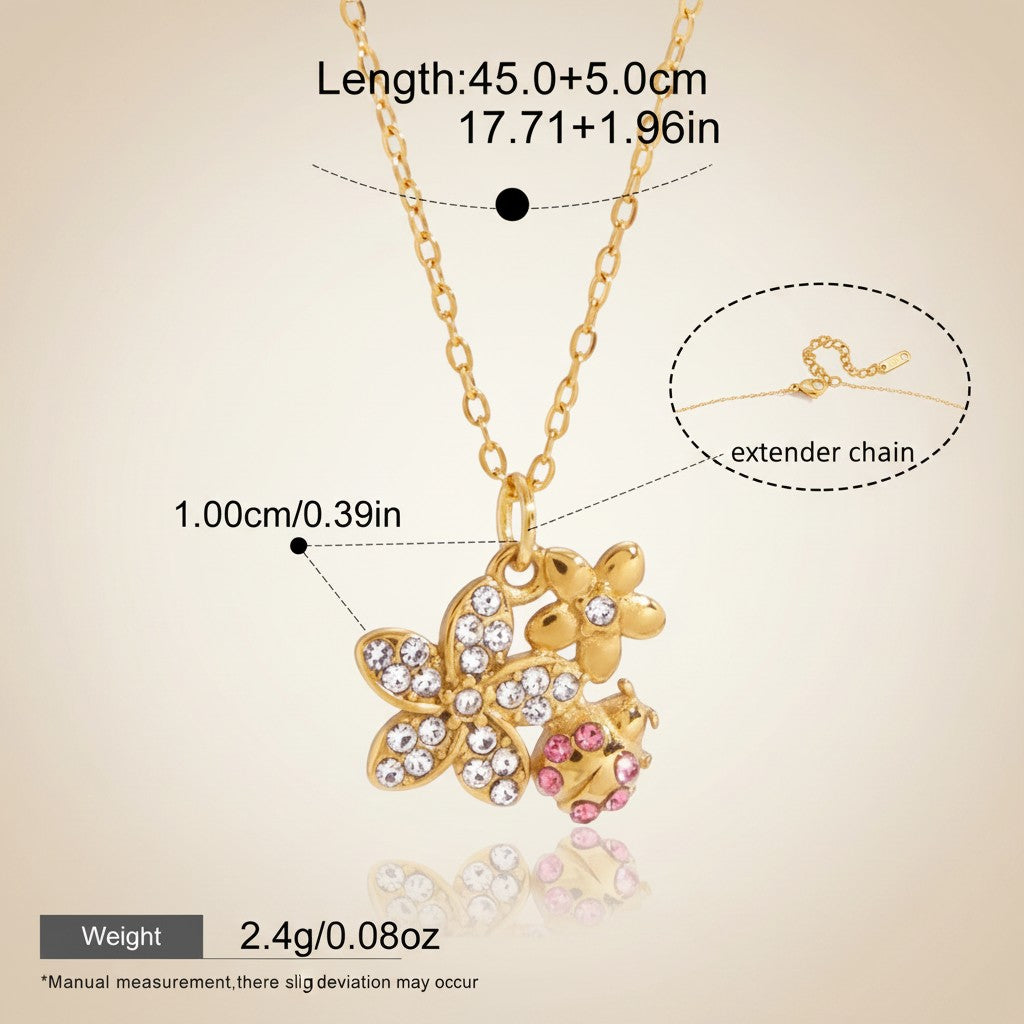 Seraphina Treasures gold-tone necklace with a floral and ladybug charm adorned with clear and pink cubic zirconia stones.