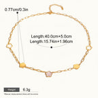 Seraphina Treasures gold-tone necklace with a delicate chain and alternating cloud and floral charms. Features a pink stone in the center of one flower charm.