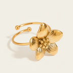 Seraphina Treasures gold open band ring with a detailed floral motif, perfect for adding natural charm.