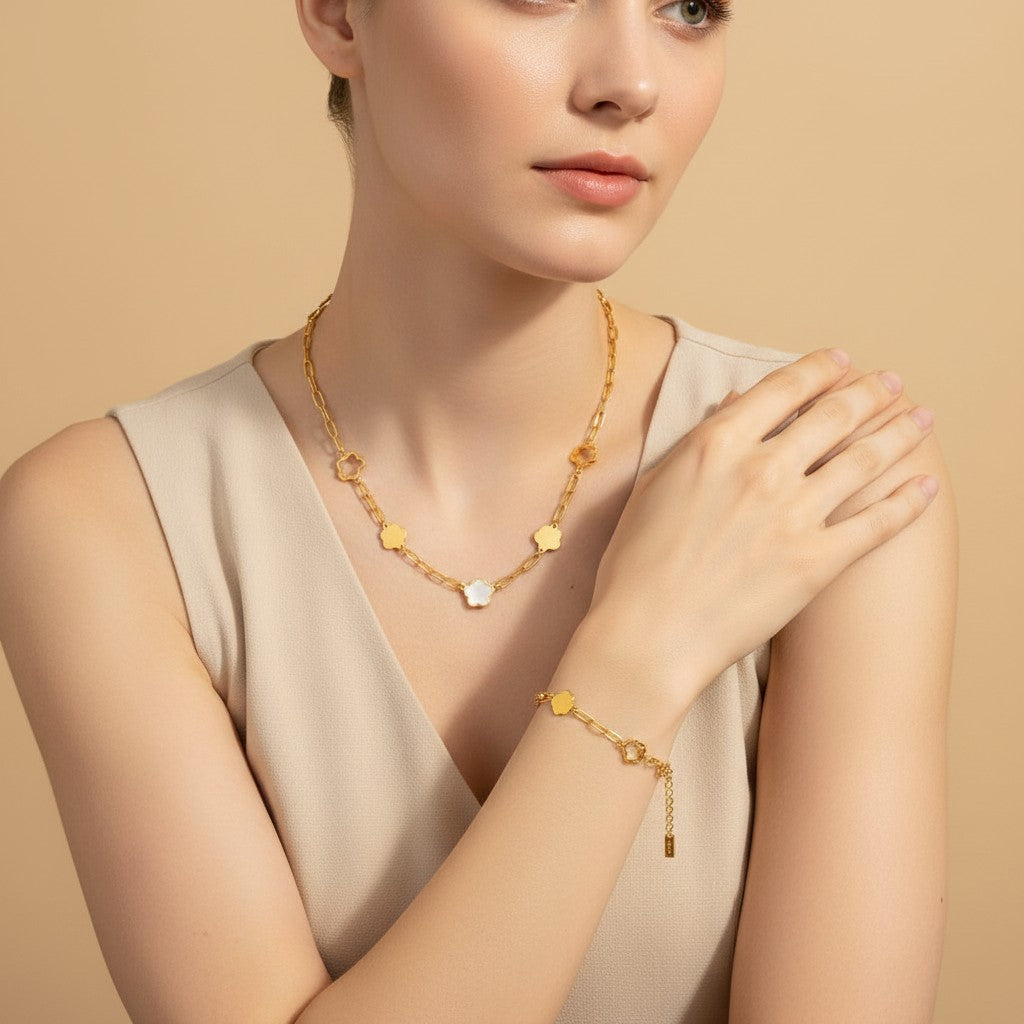 Seraphina Treasures gold-tone necklace and bracelet set with flower and cloud charms, featuring mother-of-pearl accents.