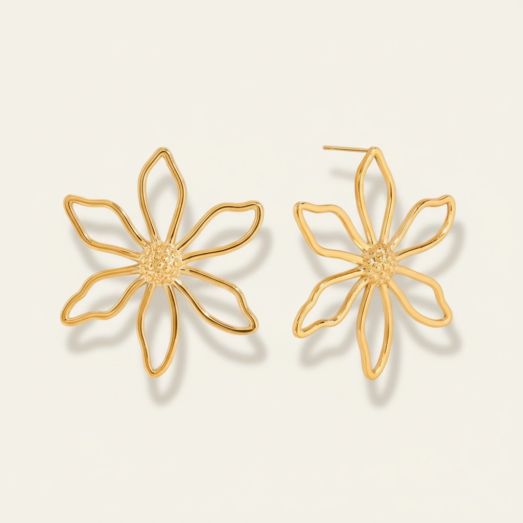 Seraphina Treasures gold hollow flower stud earrings with textured center. Delicate floral design.