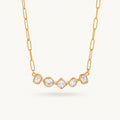 Seraphina Treasures gold necklace with five geometric cut clear zircon stones in round, square, and rectangular shapes.