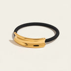 Seraphina Treasures Khepri gold-tone hair ring on black elastic band, adds texture to hairstyles.