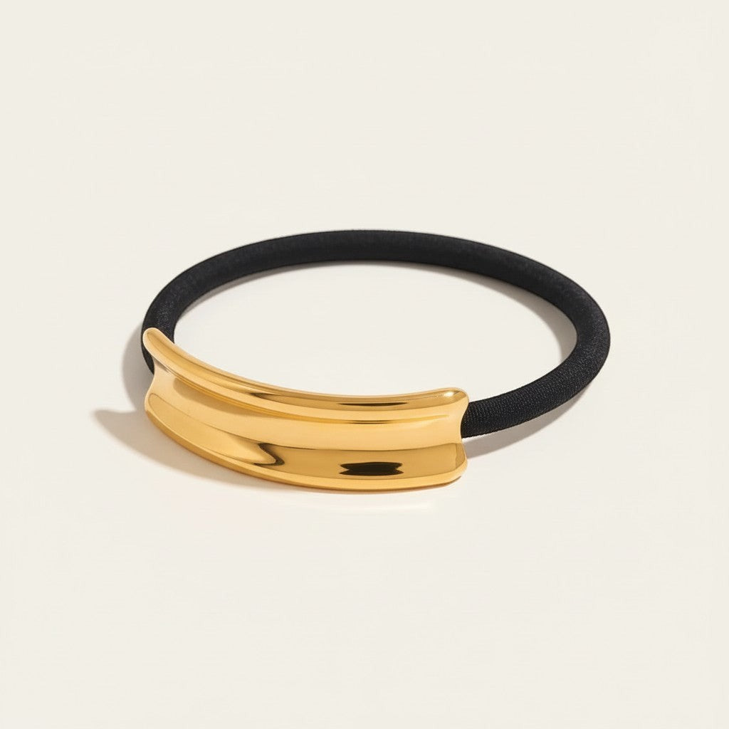 Seraphina Treasures Khepri gold-tone hair ring on black elastic band, adds texture to hairstyles.