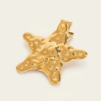 Seraphina Treasures gold hammered sea star hairpin. Elegant hair fork with textured finish.