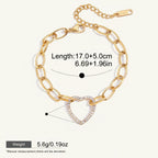 Seraphina Treasures gold-tone bracelet with a crystal-encrusted heart pendant and chunky oval links. Adjustable length.
