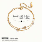 Seraphina Treasures gold-tone two-tier bracelet with cubic zirconia heart charms and small beads. Adjustable chain.